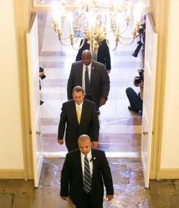 Representative John A. Boehner, the House speaker, arrived at the Capitol on Thursday with his security personnel on the third day of the government shutdown.