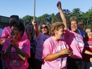 Market Basket employees celebrate the return of Arthur T.
