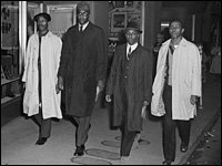 David Richmond (from left), Franklin McCain, Ezell Blair Jr., and Joseph McNeil leave the Woolworth in Greensboro, N.C., where they initiated a lunch-counter sit-in to protest segregation, Feb. 1, 1960. (No photographers were allowed into the store on the first day of protest.)